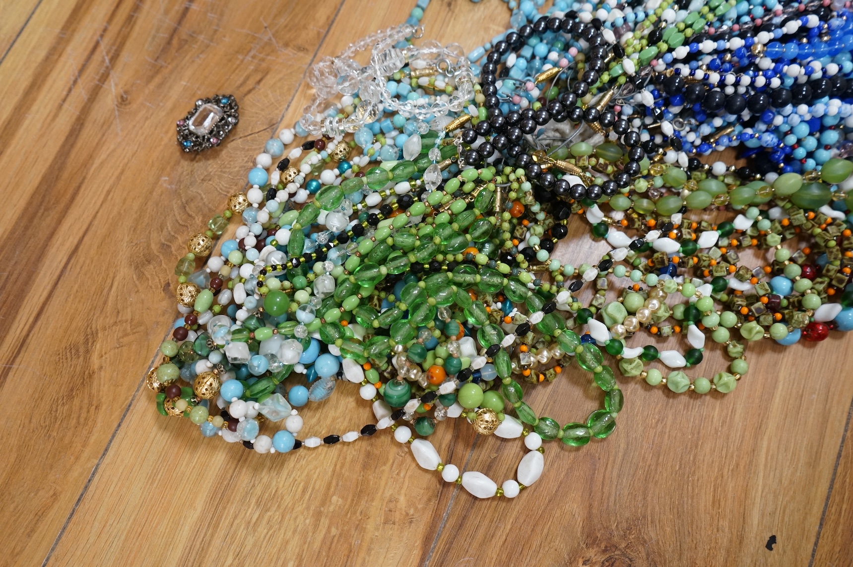 A large collection of glass bead necklaces